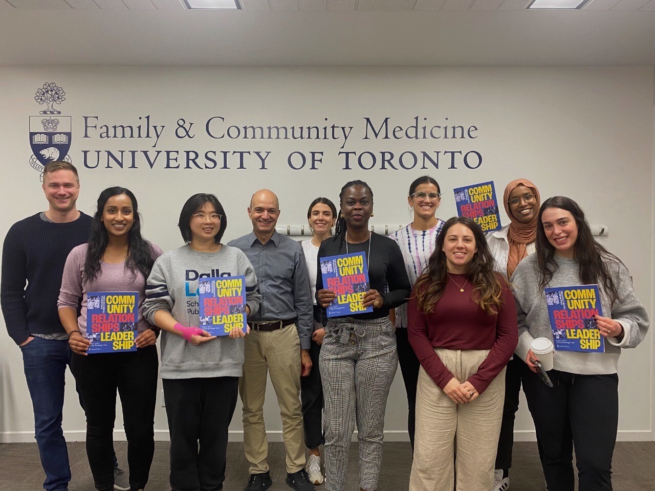 INTAPT participants holding copies of the DFCM Strategic Plan